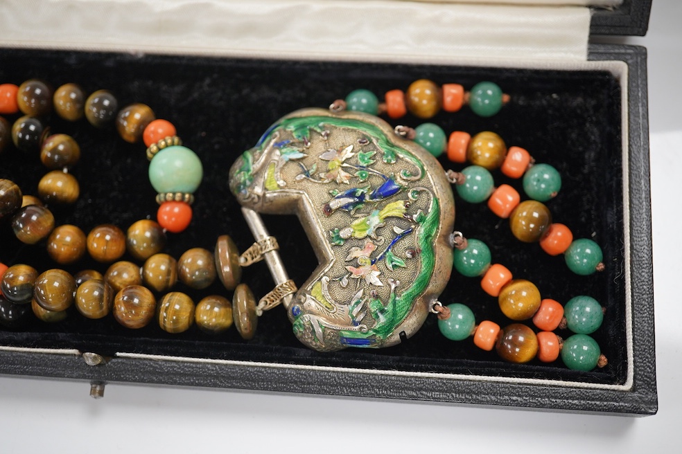 A Chinese silver and enamel amulet tiger's eye, coral and turquoise bead necklace, housed in a liberty box. Condition - good